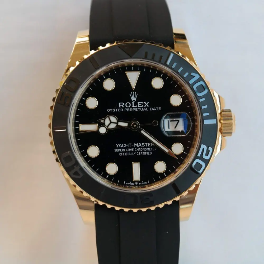 THE OYSTER PERPETUAL YACHT-MASTER 42 IN 18 CT YELLOW GOLD WITH A BLACK DIAL AND AN OYSTERFLEX BRACELET.